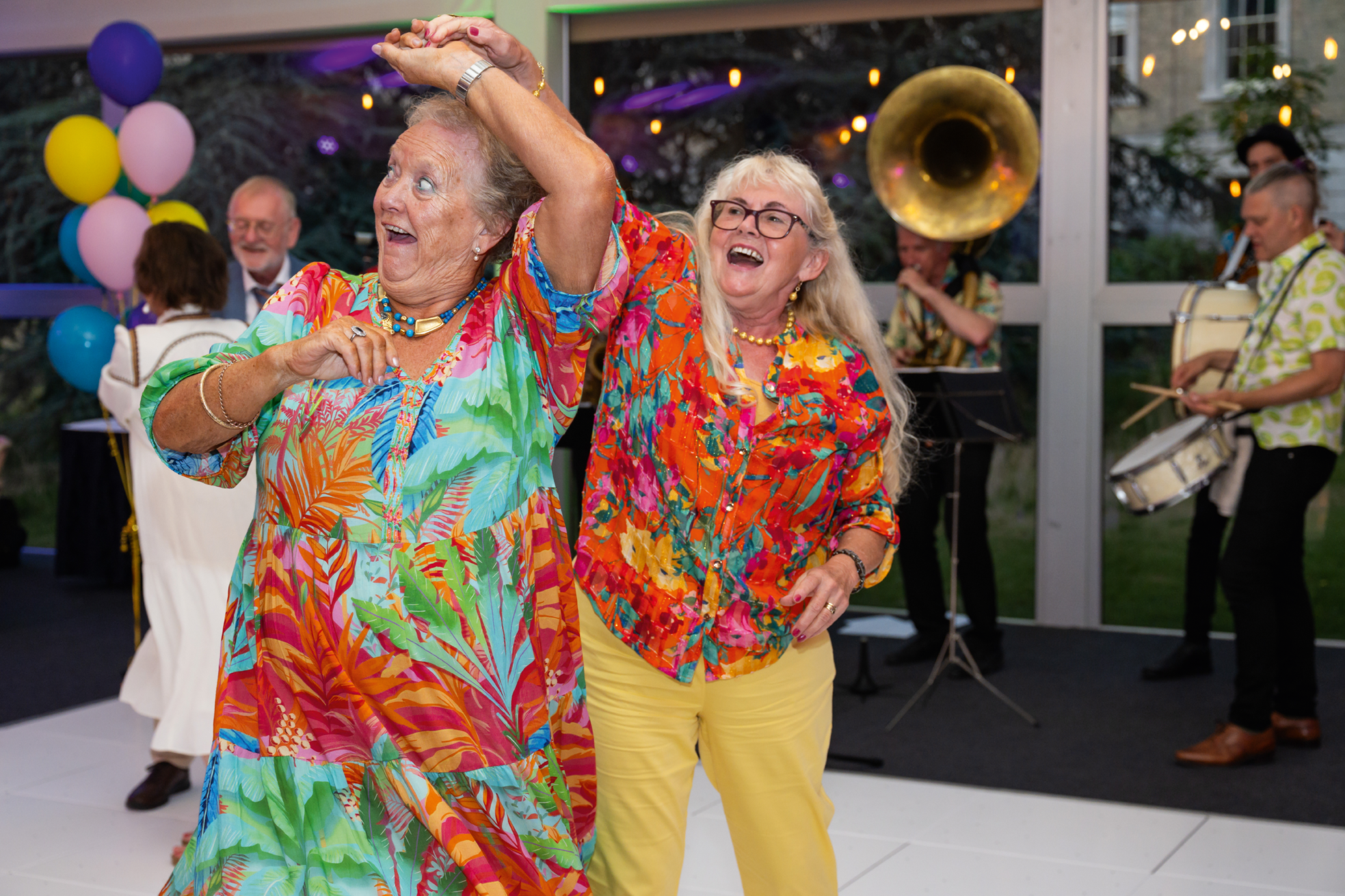 Ladies dancing in colourful outfits