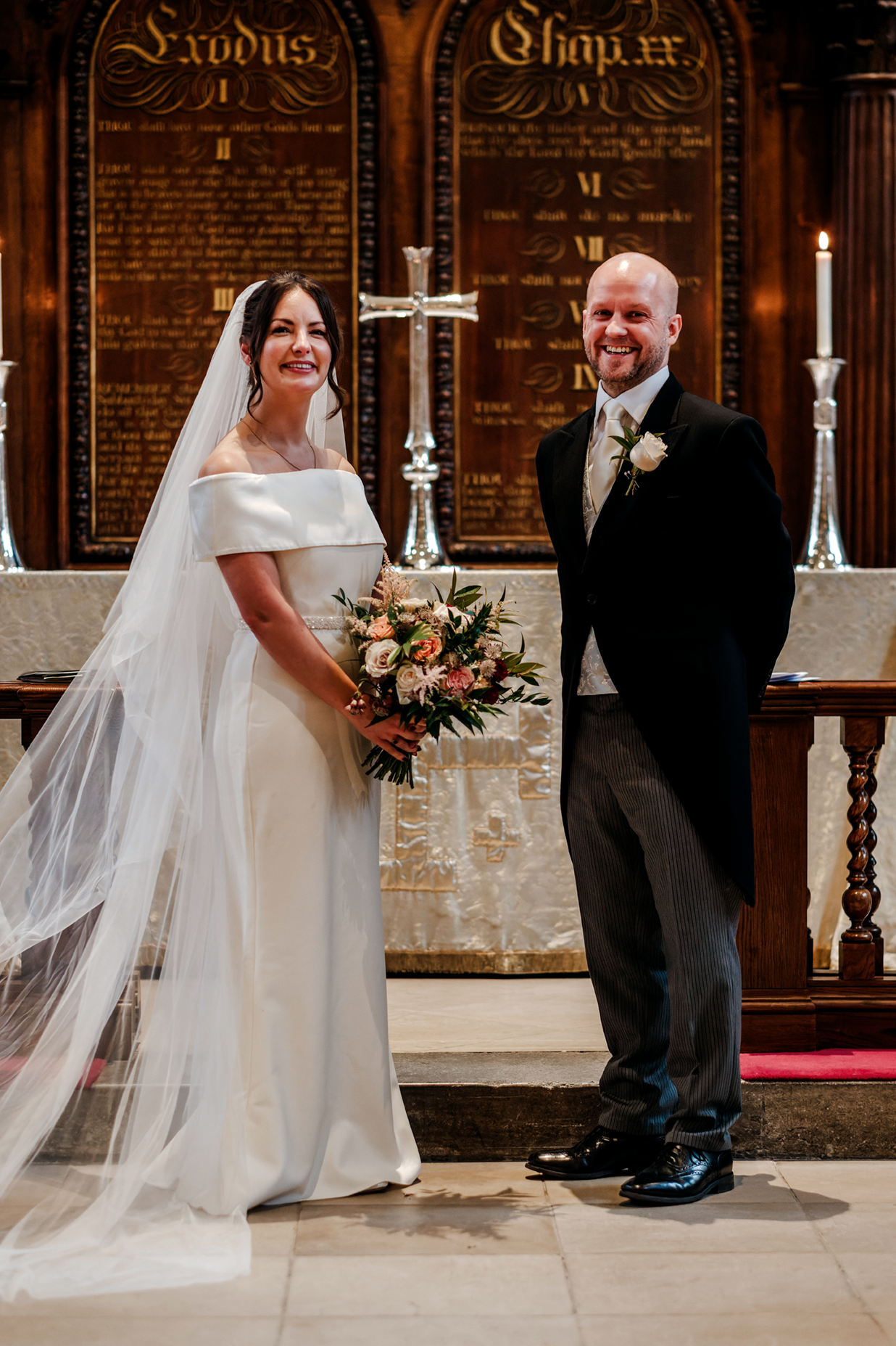 Bride and groom standing at the alter