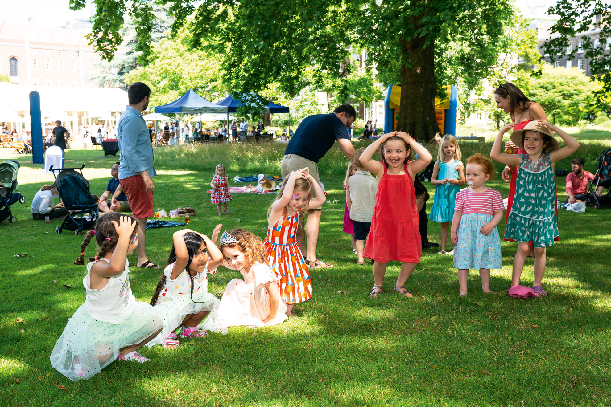Children playing on the lawn in the sun 