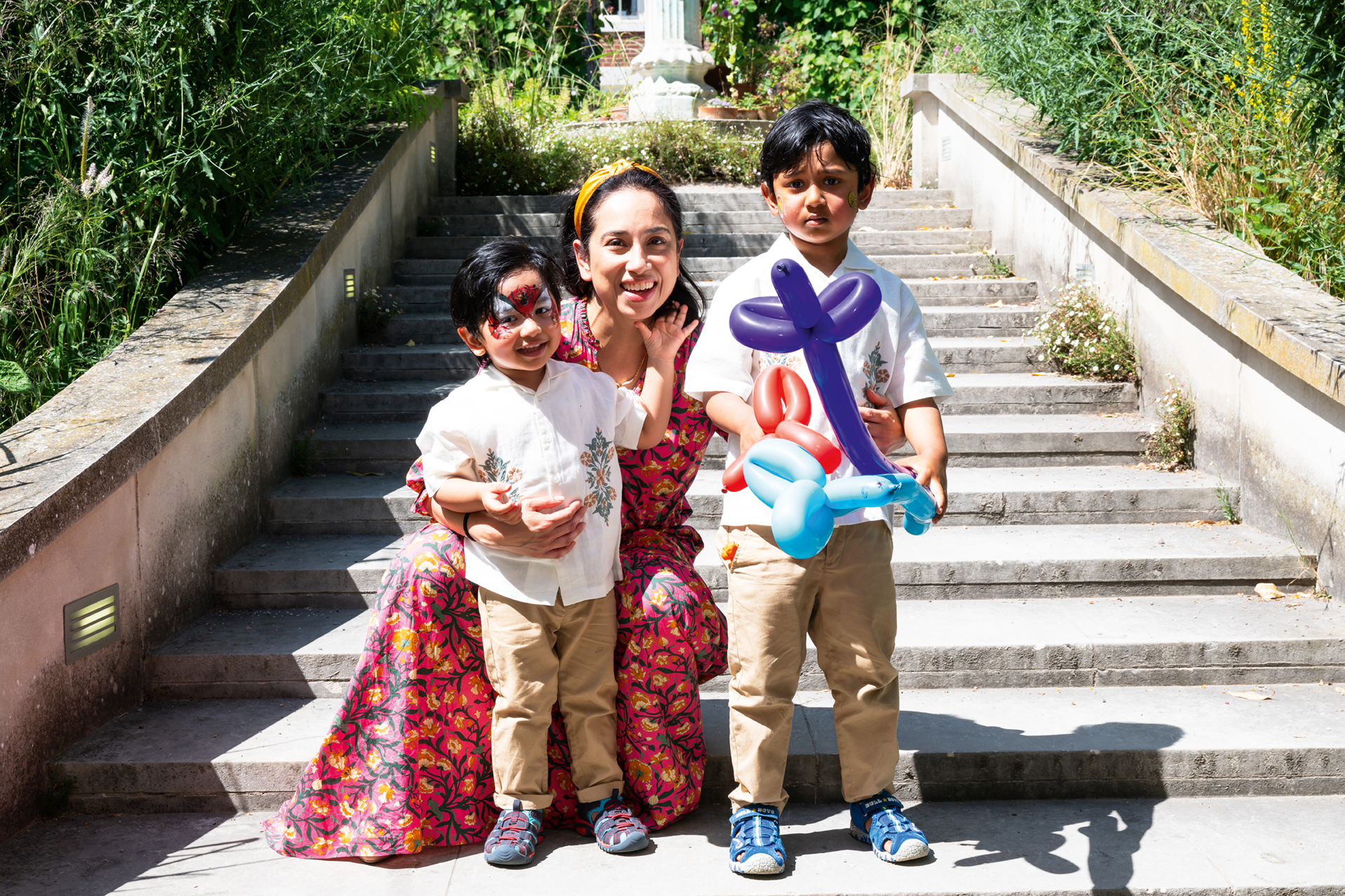Children and their parent with balloon animals 