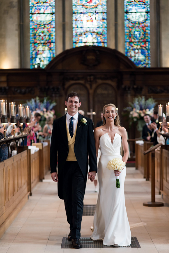 Bride and groom walking down the aisle