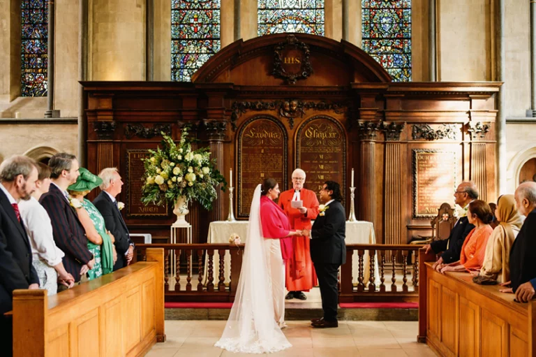 Bride and groom standing at the alter