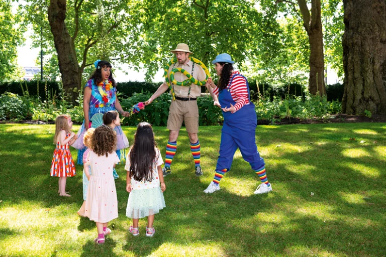 A small group of people standing in a circle playing