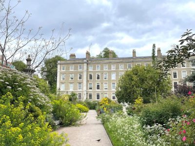 The Inner Temple Garden in early summer, looking down the main path between billowing borders