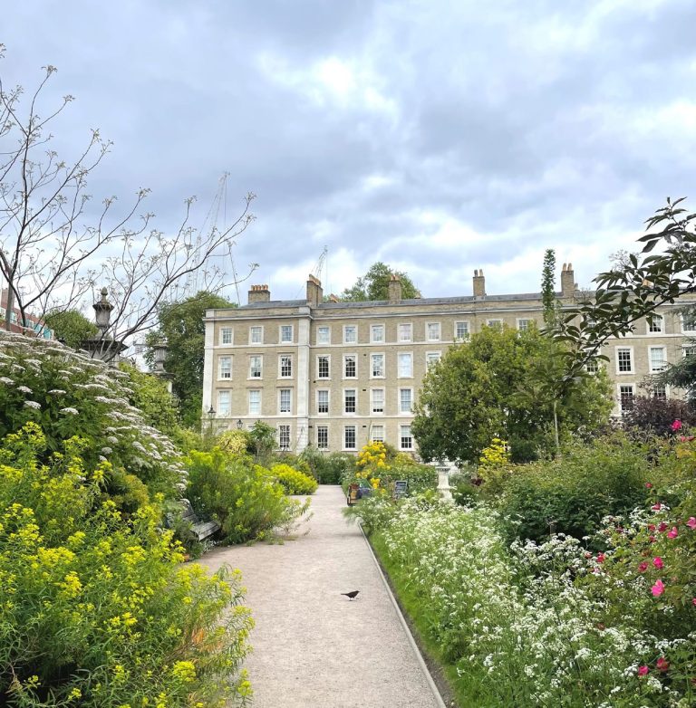 The Inner Temple Garden in early summer, looking down the main path between billowing borders