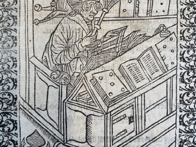 A medieval woodcut of a scholar writing at a book-covered desk, from the Inner Temple Library special collections