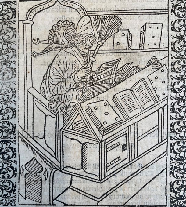 A medieval woodcut of a scholar writing at a book-covered desk, from the Inner Temple Library special collections